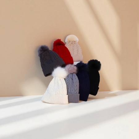 A multi-color knitted woolen cap with large wool ball decoration for warm winter knitted cap A multi-color knitted woolen cap with large wool ball decoration for warm winter knitted cap